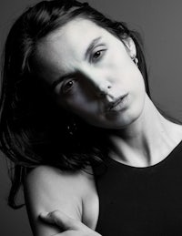 a black and white photo of a woman posing