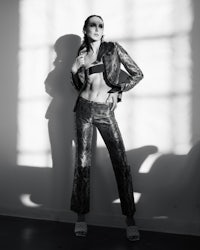 a woman is posing in a black and white photo