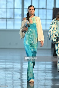 a model walks the runway at the show during london fashion week